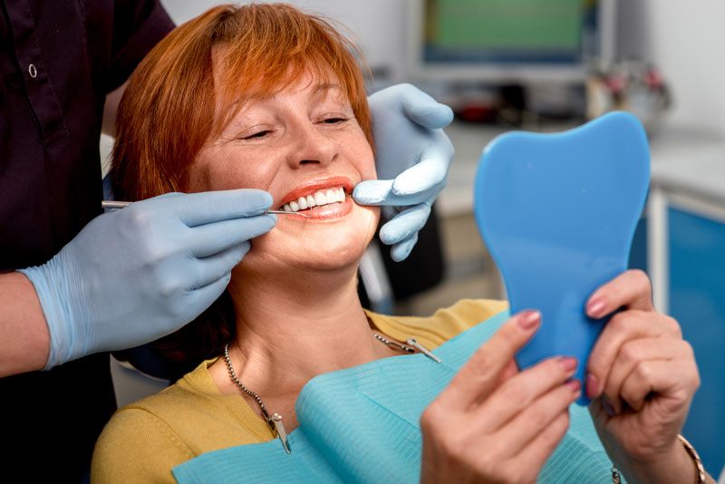 Full Arch Dental Implant Patient During Her Dental Procedure