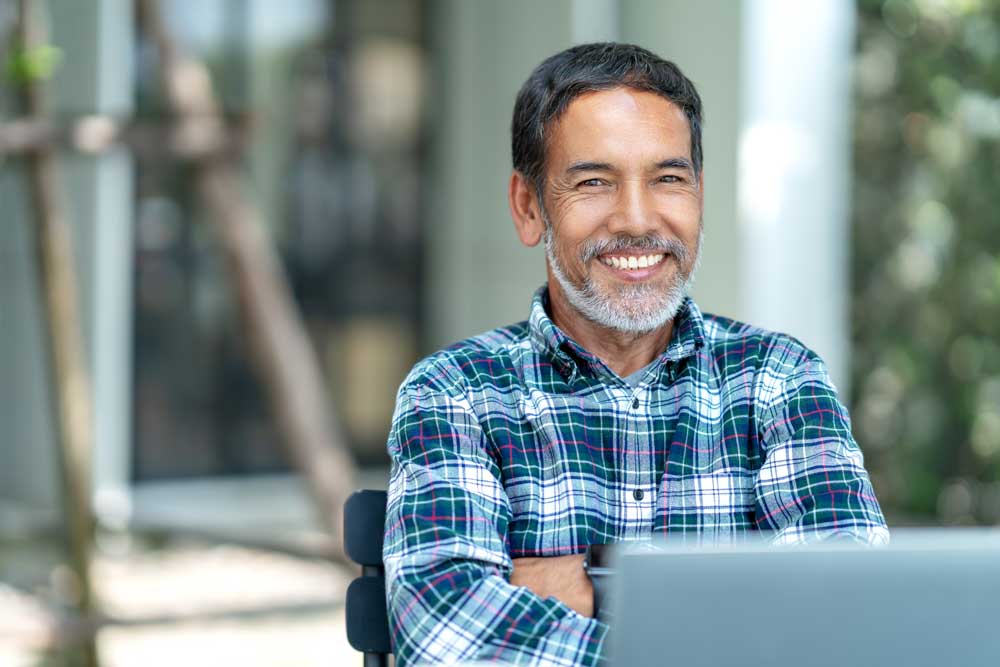 dental patient smiling after his cosmetic dentistry procedure