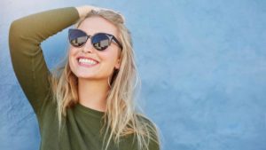 patient smiling after her cosmetic dentistry procedure