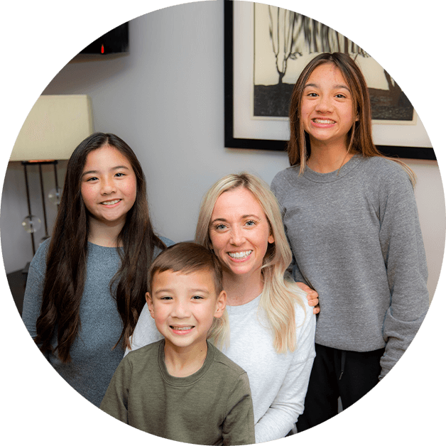 family smiling at dentist