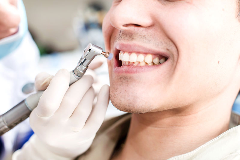 a patient undergoing a teeth cleaning procedure.