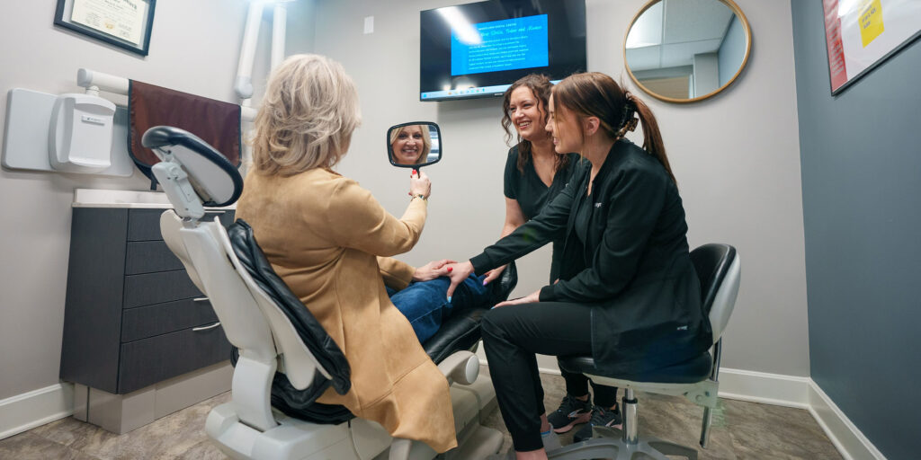 Patient Smiling into mirror