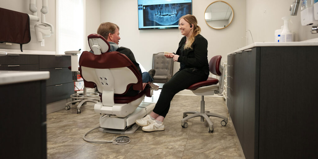 Team member consulting with Patient about dental implants